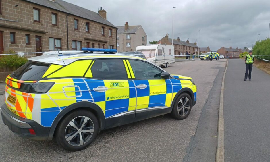 Police car parked across Catto Drive in Peterhead.