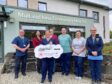 A helipad plan on the Isle of Mull has been boosted with a £400,000 cheque from a Help Award. Picture shows staff from the hospital standing outside the front door of the hospital at Java on Mull.