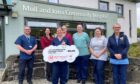 A helipad plan on the Isle of Mull has been boosted with a £400,000 cheque from a Help Award. Picture shows staff from the hospital standing outside the front door of the hospital at Java on Mull.