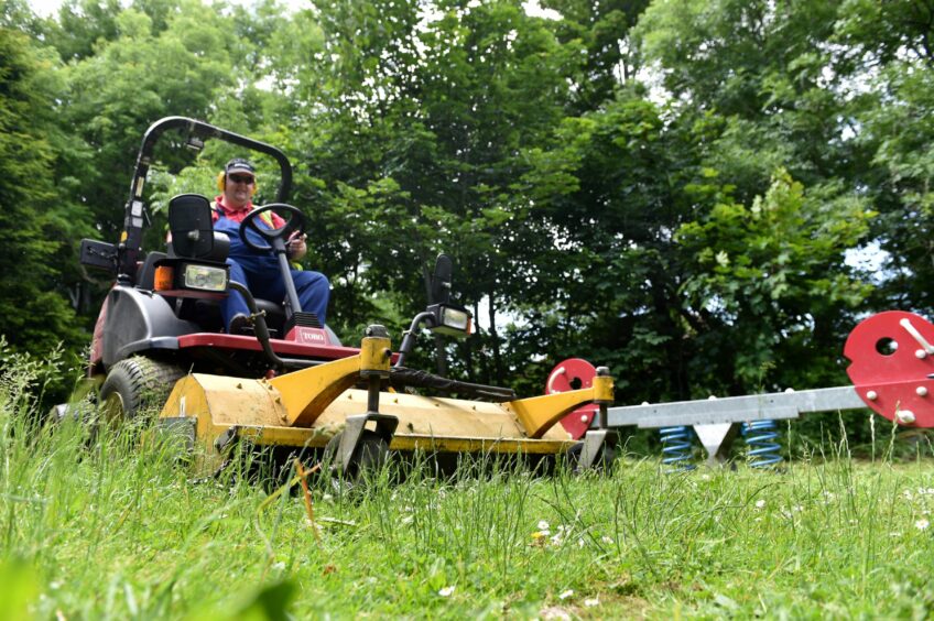 Would you take a council tax freeze if it meant grass cutting would cease in Aberdeen? That's what council bosses want to learn with their budget survey. Image: Darrell Benns/DC Thomson