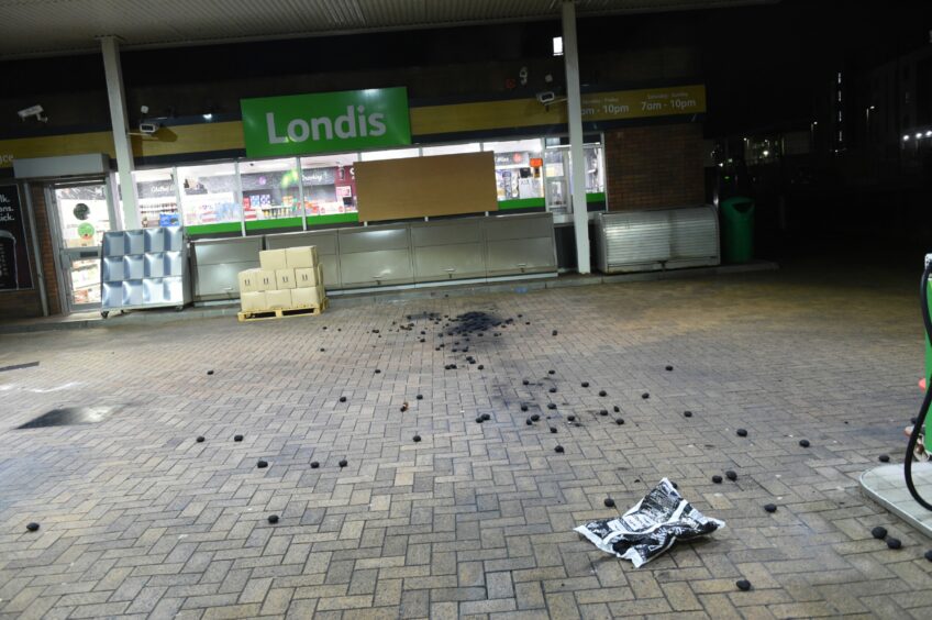 Coal is seen scattered across the BP filling station in Dyce.