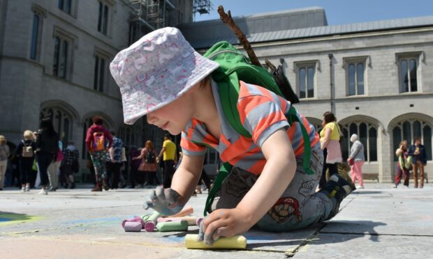 Youngster creating their own art work. Image: Darrell Benns/DC Thomson. Saturday 10th June 2023.