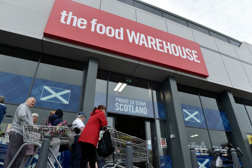 Some of the first customers waiting to go inside as The Food Warehouse opens in Aberdeen.