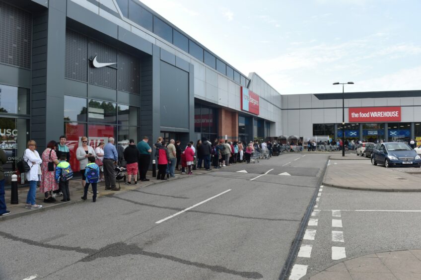 People queuing for the opening of The Food Warehouse in the Berryden car park in Aberdeen.