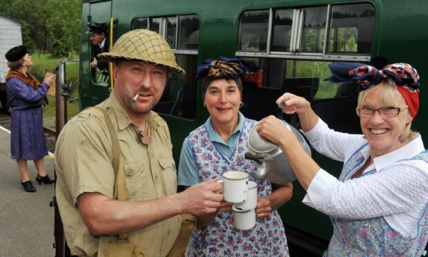 'Soldier' Nigel Bodiam, and tea ladies Lynne Millar and Penny Balmer at the 1940s weekend in 2013. Image: DC Thomson