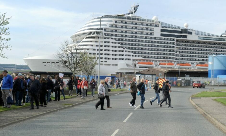 People line the streets as The MSC Cruise Ship, MSC Meraviglia, docks in Invergordon.
