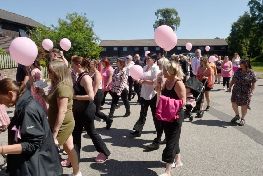 Sunny skies and pink balloons held by hundreds of supportive friends and family of Mia Macphee. Image by Sandy McCook / DC Thomson.