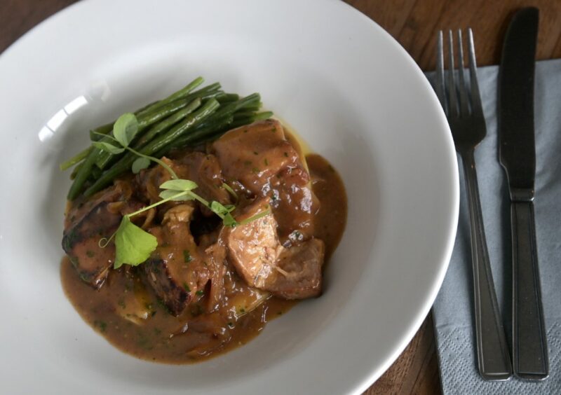 Braised Morayshire pork in a cider, Dijon and onion sauce with creamed potatoes and green beans.