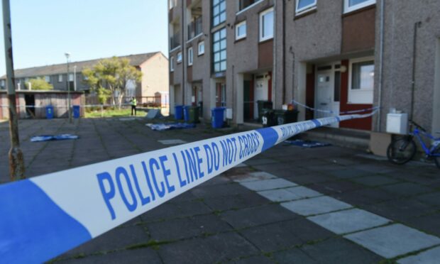 Police at the scene of the stabbing in Esk Road, Inverness. Image: Sandy McCook / DC Thomson.