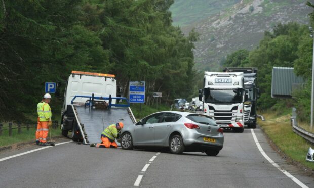 A silver Vauxhall Astra being recovered south of Aviemore