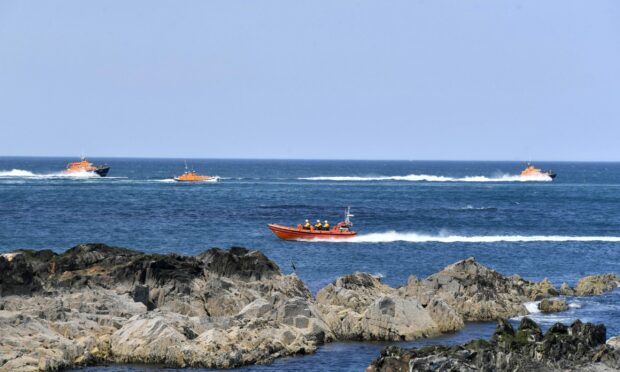 Lifeboats in the sea.