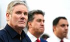(left to right) Labour leader Sir Keir Starmer, shadow climate change secretary Ed Miliband and Scottish Labour leader Anas Sarwar at the launch of the Labour party's mission on cheaper green power. Image: PA.