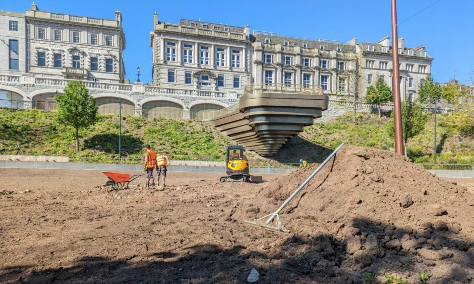 Work continued on the Union Terrace Gardens lawn on June 15, as the tourists flocked to Aberdeen city centre. Image: Alastair Gossip/DC Thomson