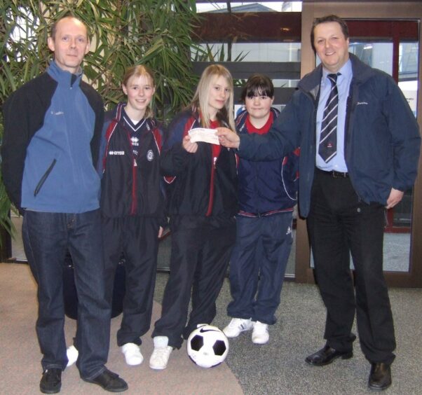 Loren Campbell, as part of the Aberdeen FC Ladies U15s squad in 2006 ahead of the Gothia Cup in Sweden, alongside coach and dad Graham.