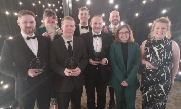 A photo of Left to right: Impact reporter Brendan Duggan, live team reporter Louise Glen, investigations reporter Dale Haslam, city reporter Alastair Gossip, editor of The Press and Journal Craig Walker, North journalist Stuart Findlay, sports reporter Sophie Goodwin and features writer Ellie House at the 44th Scottish Press Awards.