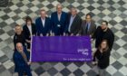 Aberdeen chiefs celebrate with the Purple Flag award. From left to right: Ryan Manson, general manager of Union Square,  Chief Inspector David Paterson of Police Scotland, Emily Hailstones, Olive Alexanders, Adrian Watson, chief executive officer of Aberdeen Inspired, Innes Walker, city centre manager at Aberdeen Inspired, Steve Whyte, director at Aberdeen City Council, Councillor Martin Greig, Vincent Amsoms, general manager, ibis Aberdeen, Councillor Miranda Radley. Image: Aberdeen City Council.