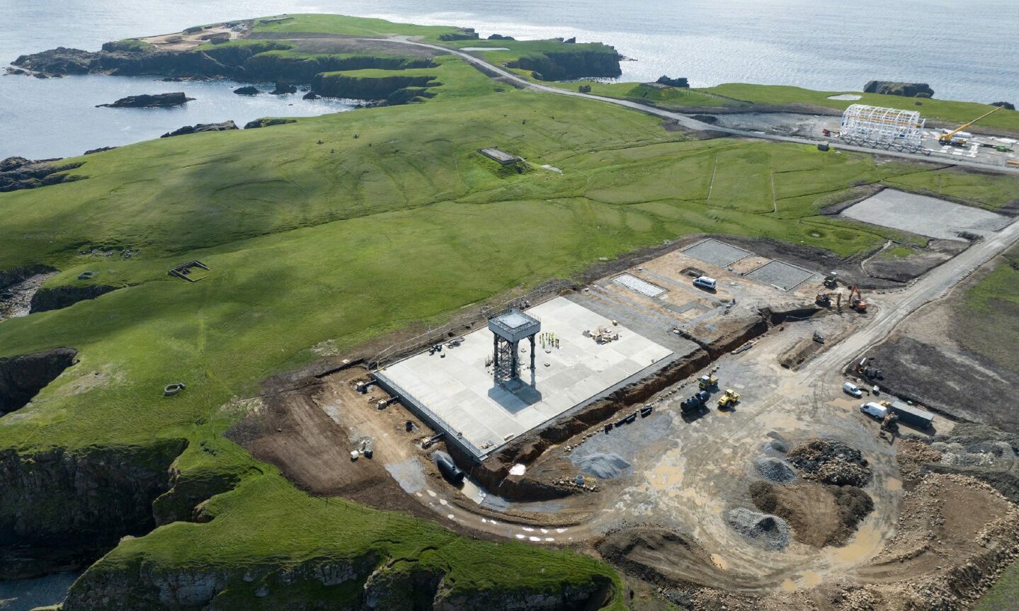 Aerial view of Shetland spaceport with view to sea behind.