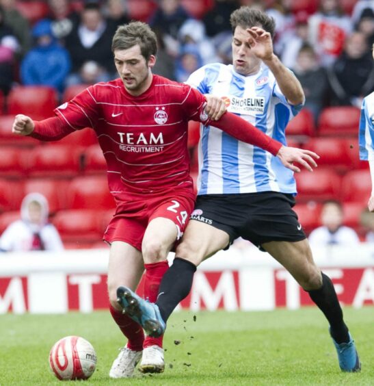 Aberdeen's 2009/10 horizontally-pinstriped home kit, as worn by Michael Paton.