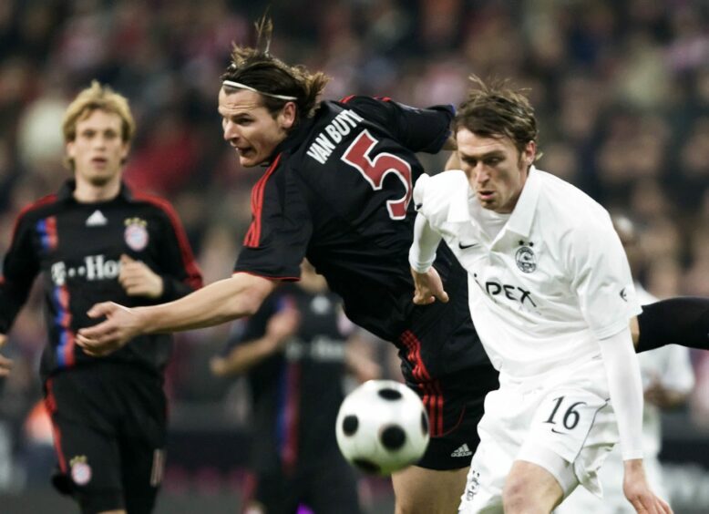 Aberdeen's Lee Miller (right) tussles with Bayern Munich defender Daniel van Buyten at the Allianz Arena in 2008.