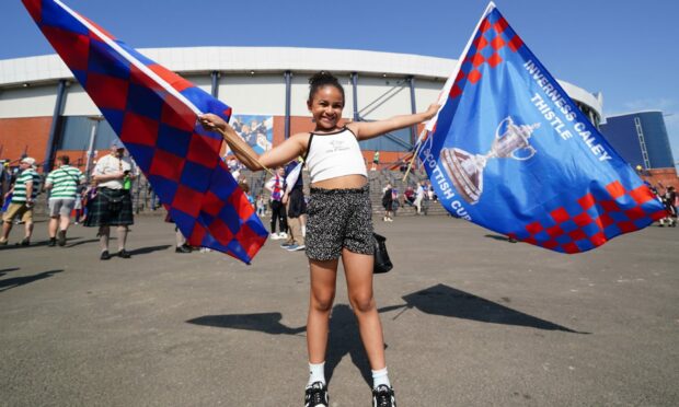 Ruby Cameron, 8, outside the stadium before the Scottish Cup final at Hampden Park. Image: PA.