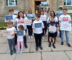 Campaigners against cuts to school admin and clerical worker jobs protested outside Moray Council in June.