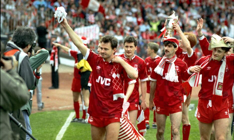 Charlie Nicholas after winning the Scottish Cup with Aberdeen in 1990. From left, Charlie Nicholas, Jim Bett, Bobby Connor, Alex McLeish with the cup and David Robertson. Image: DC Thomson.