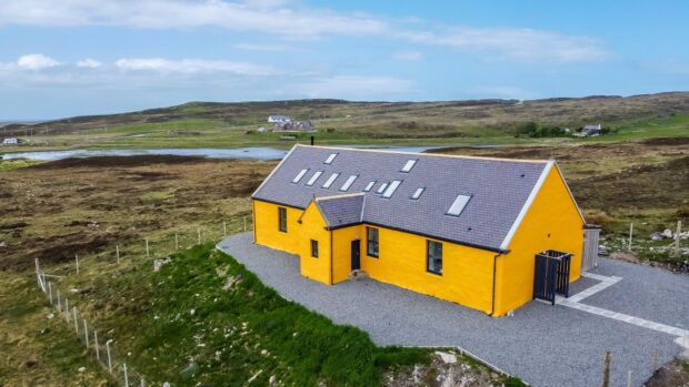 Stoer Hostel in the Highlands is a bright yellow building in the Sutherland Highlands on the route of the North Coast 500.