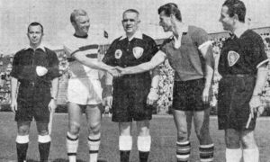 Bobby Moore shakes hands with his Polish counterpart as Jim McLean stands in the middle. Image: Steve Marsh.
