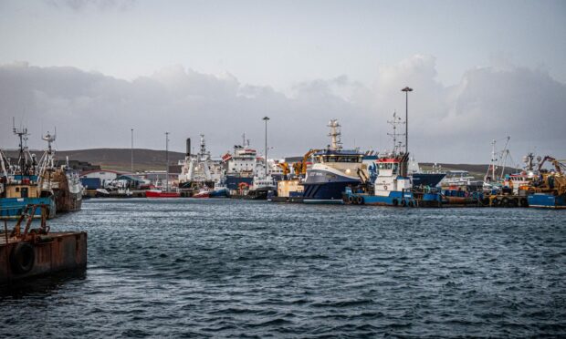 Lerwick lifeboat towed the broken down vessel back to Lerwick Harbour. Image: Wullie Marr / DC Thomson.