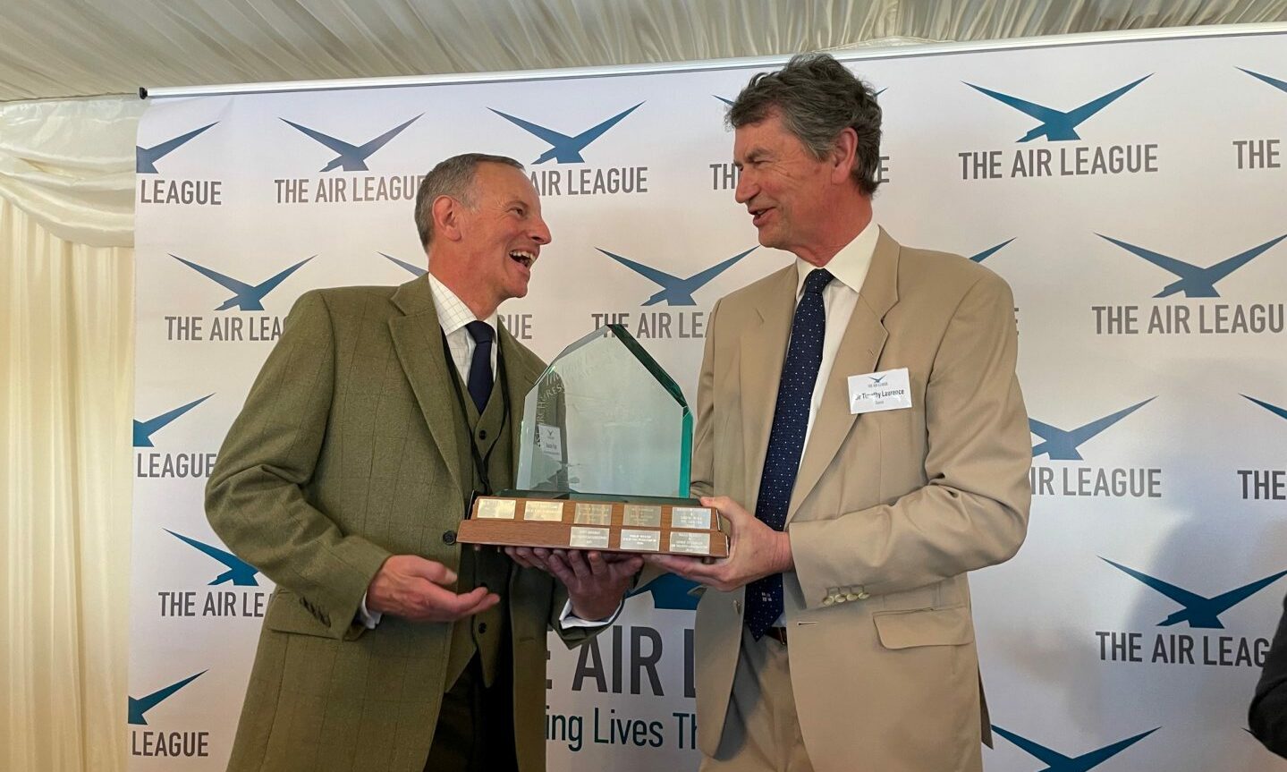 Duncan Tripp and Vice Admiral Sir Tim Laurence share a joke on stage as Mr Tripp is presented with his award at the House of Commons in London this week.