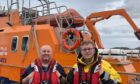 Father Paul and son Bobby stand in front of the Severn-class all-weather lifeboat, Elizabeth Fairlie.