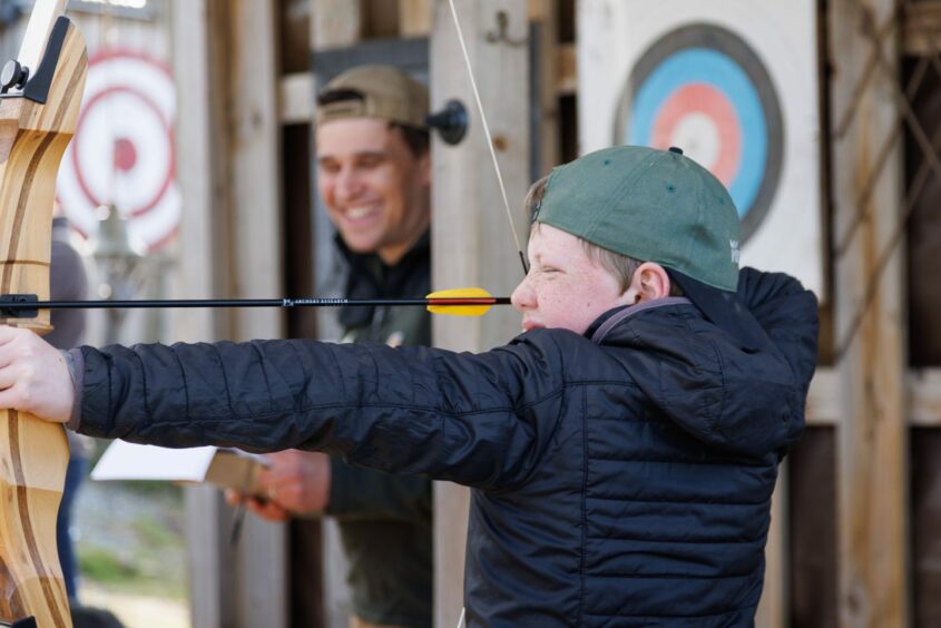 Youngster practicing their archery skills. 
