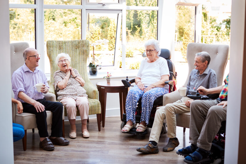 A photo of people in a care home.