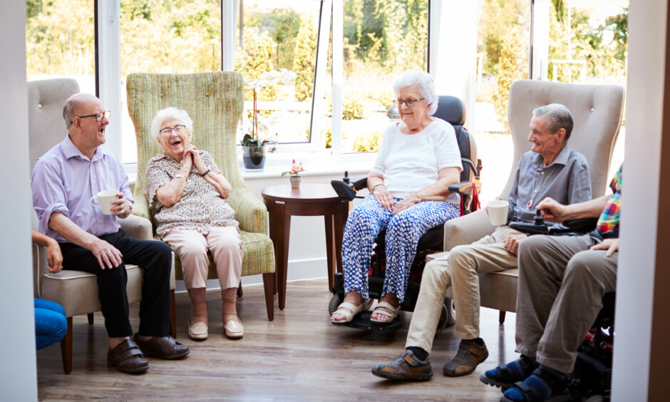 A photo of people in a care home.