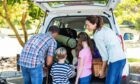 Family packing up and getting ready to do summer activities in scotland.