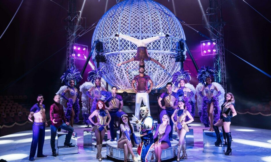 Circus Vegas performers in front of the Globe of Death.