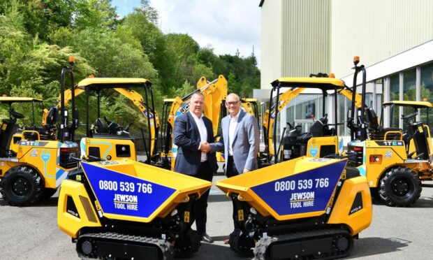 JCB Global Major Accounts MD Steve Fox (left) pictured with Jewson Business Development Director Mark Esling and the new fleet of JCB machines.