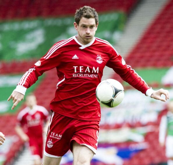 The Dons' 2011/12 red kit, worn by forward Scott Vernon at Hampden in a defeat to Hibs.