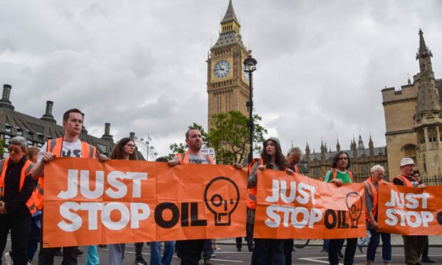 Just Stop Oil activists stage their biggest protest yet with a series of back-to-back slow marches in Parliament Square, London.