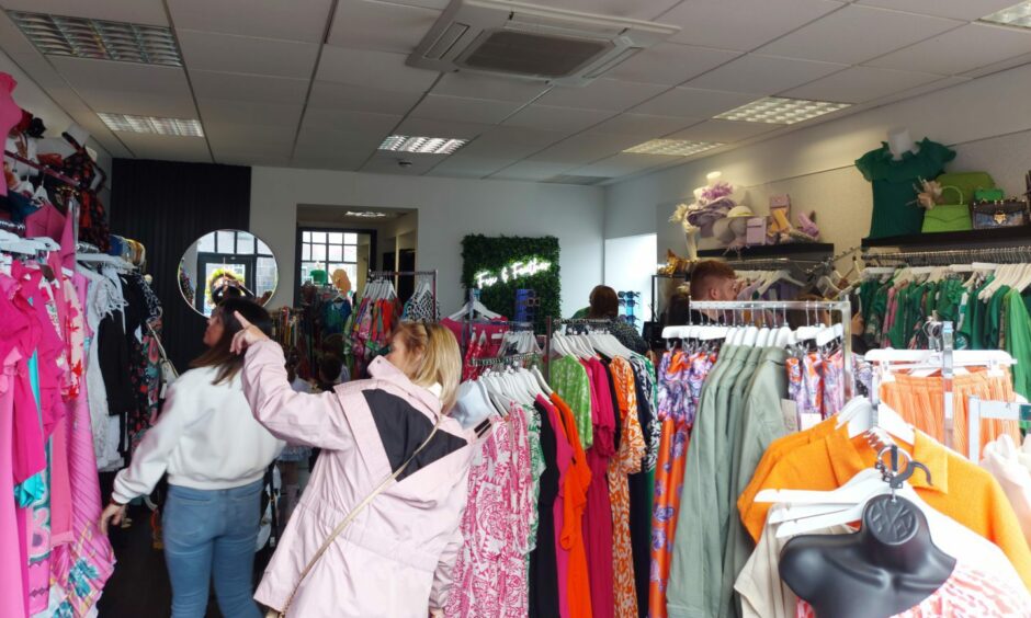 Customers browsing clothes in the boutique store Fox and Feather during Peterhead Scottish Week.