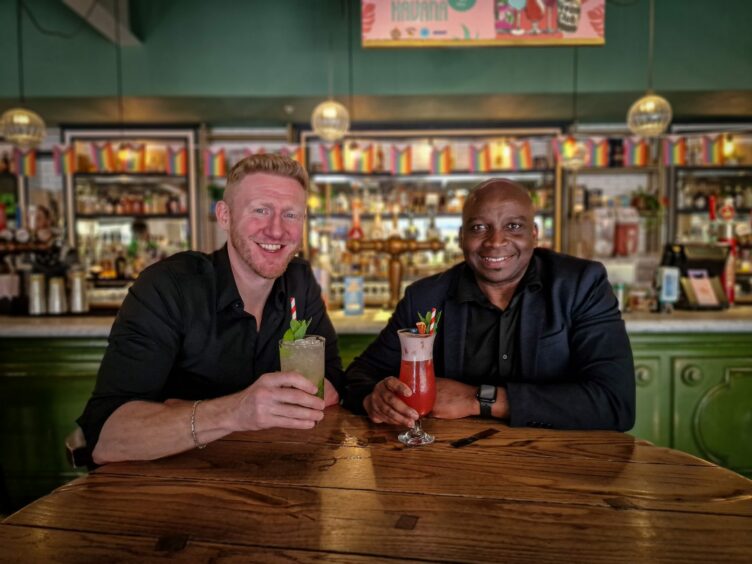 Right to left: Harmony's founder Pete Preston has the pink drink in his hand, and Revolucion De Cuba's General Manager, Russell Davidson.