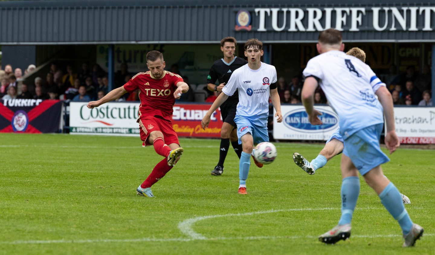 Aberdeen's Ylber Ramadani kicking the ball during a friendly against Turriff United