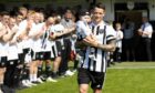 Fraserburgh's Ryan Cowie enters the field ahead of his testimonial match against Aberdeen. Image: SNS