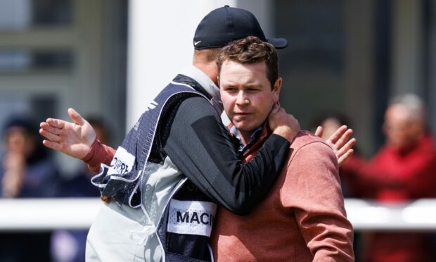 Robert MacIntyre and caddie Greg Milne on the 18th during day four of the Genesis Scottish Open. Image: SNS