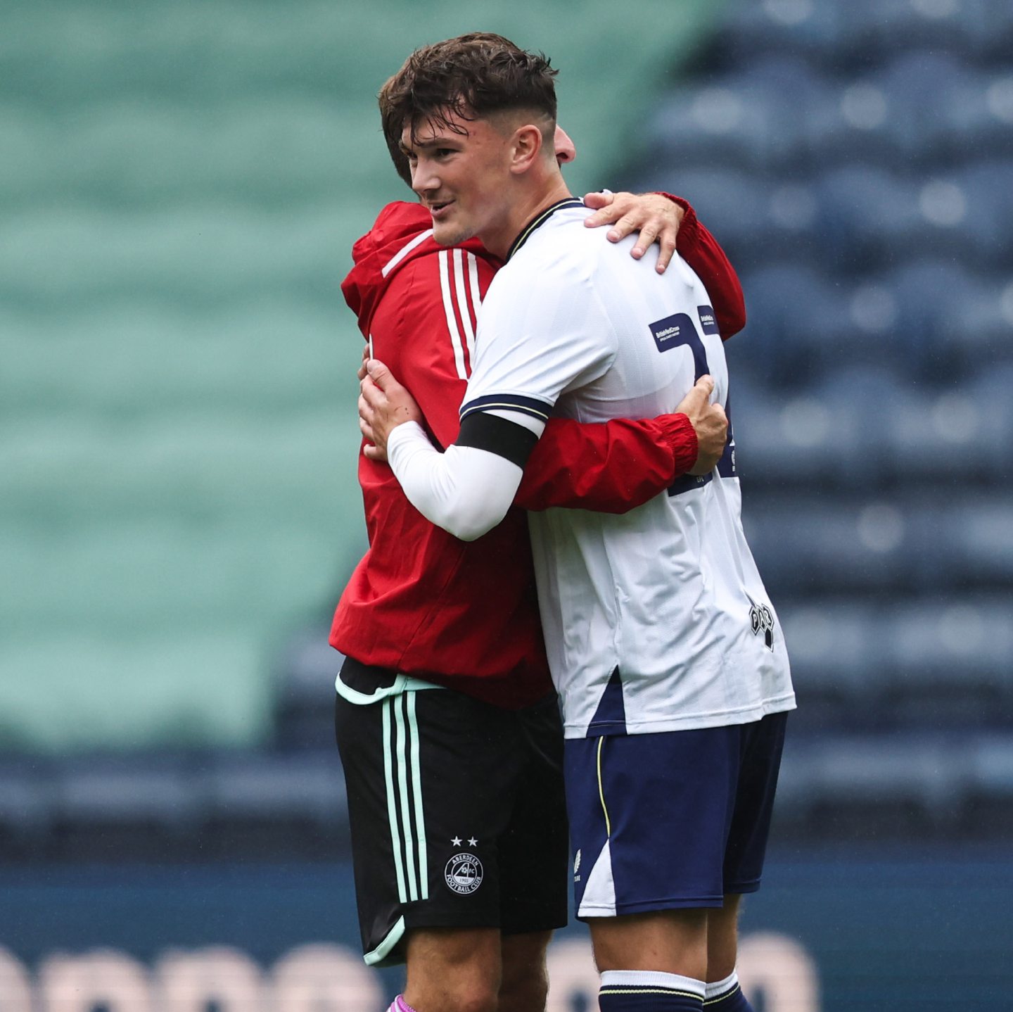 Aberdeen's Graeme Shinnie and Preston's Calvin Ramsay hugging after a friendly