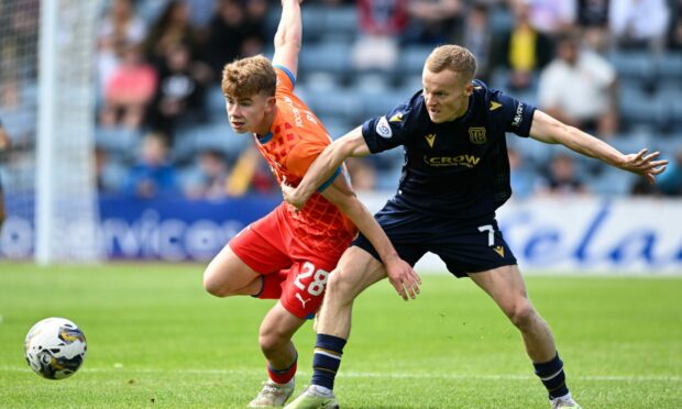 Caley Jags' Keith Bray, left, challenges Dundee's Scott Tiffoney. Images: Paul Devlin/SNS Group