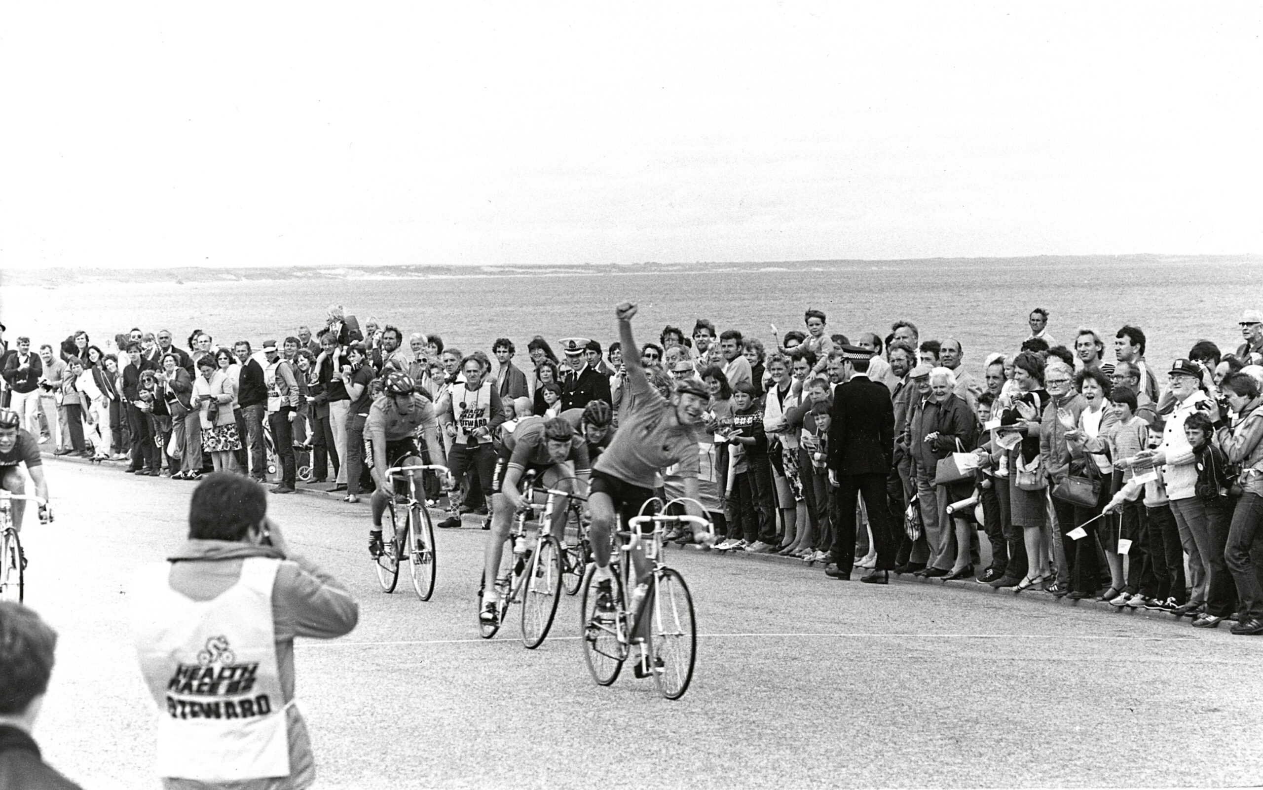 Crowds watch as cyclists cross the finish line of the Health Race in Aberdeen in July