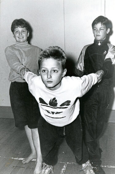 Three students dancing