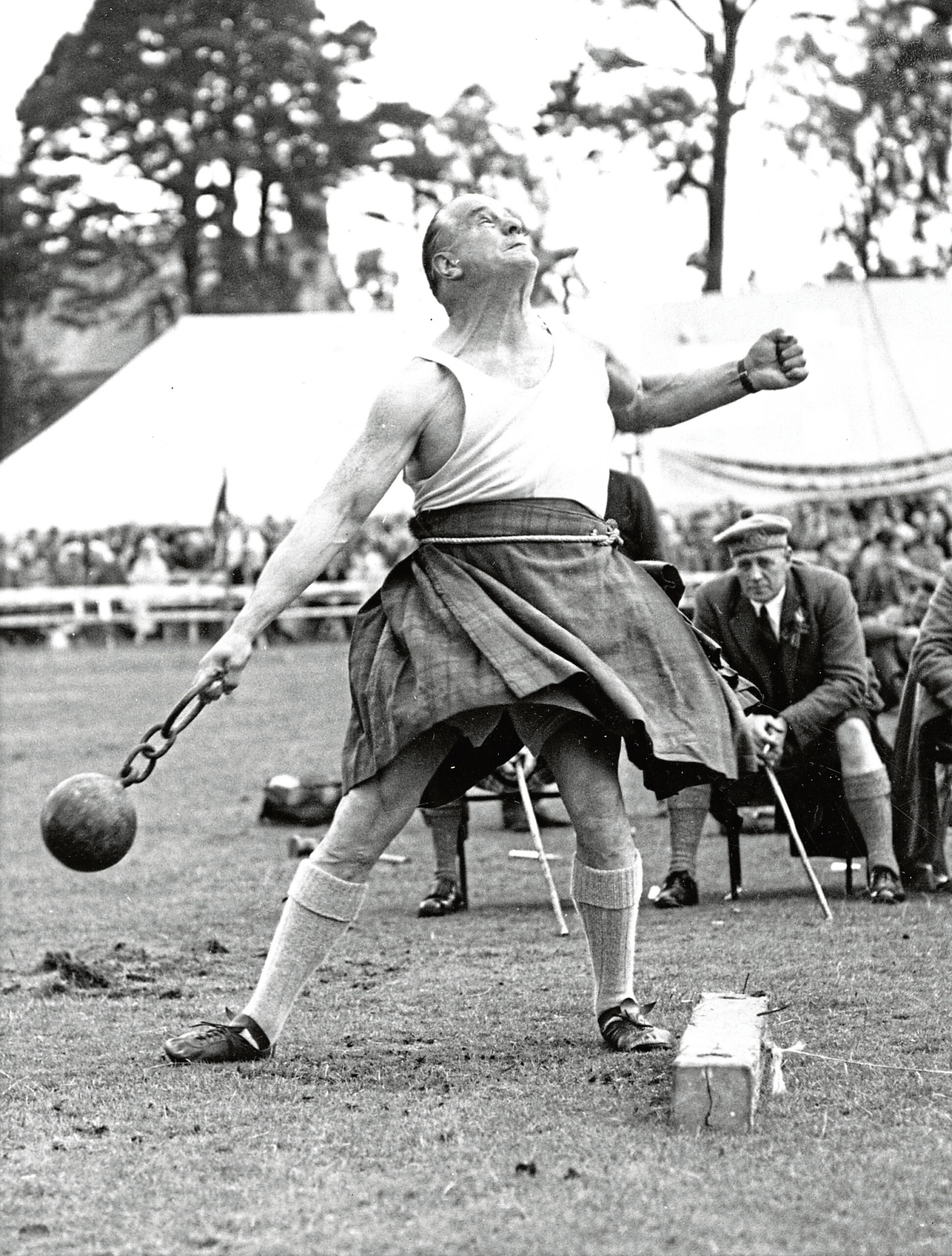  George Clark throwing the ball and chain at Aboyne Games in September 1962.