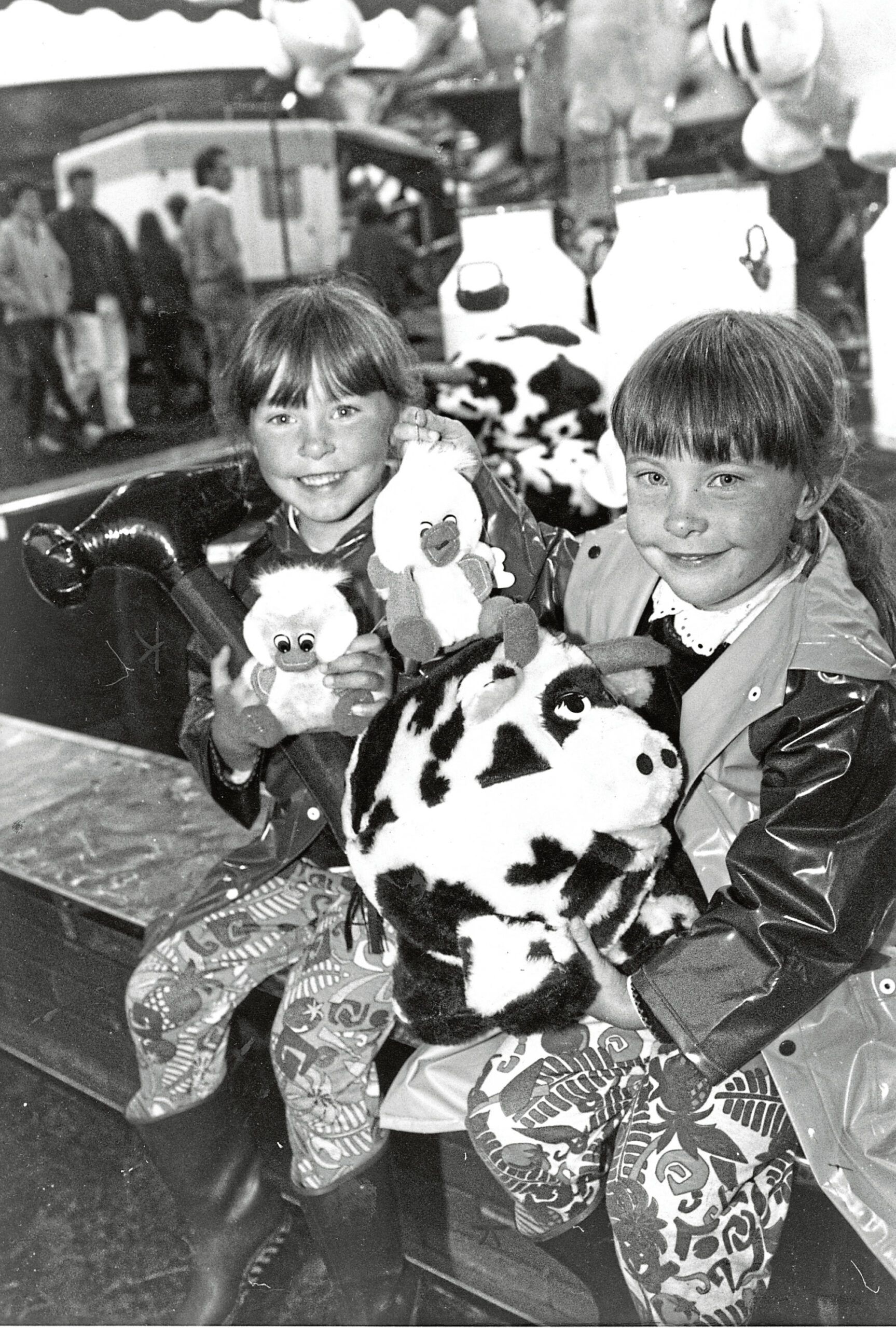 Five-year-old twins Laura and Karen Murray with toy they won on one of the stalls at the 126th games.